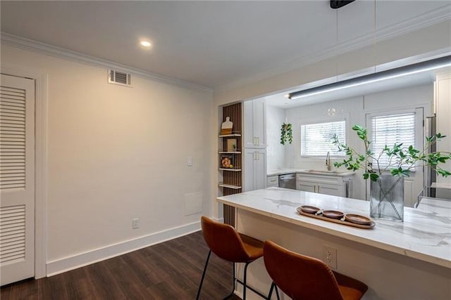 4282 Roswell Rd NE Unit G1, Atlanta, GA 30342 - dining space with dark wood-type flooring, crown molding, baseboards, and recessed lighting