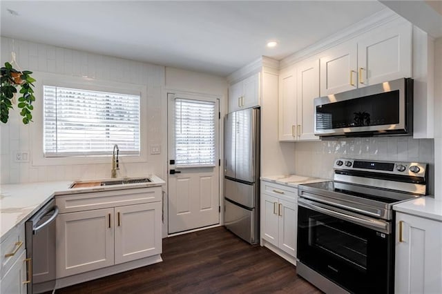 4282 Roswell Rd NE Unit G1, Atlanta, GA 30342 - kitchen featuring appliances with stainless steel finishes, a sink, white cabinetry, dark wood-style floors, and decorative backsplash