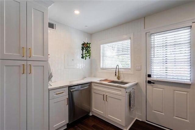 4282 Roswell Rd NE Unit G1, Atlanta, GA 30342 - kitchen with stainless steel dishwasher, a sink, white cabinetry, dark wood-style flooring, and light stone countertops
