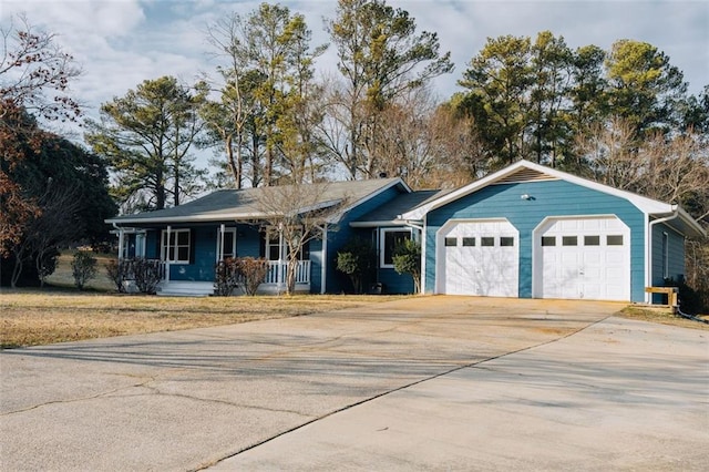 ranch-style house with a garage and covered porch