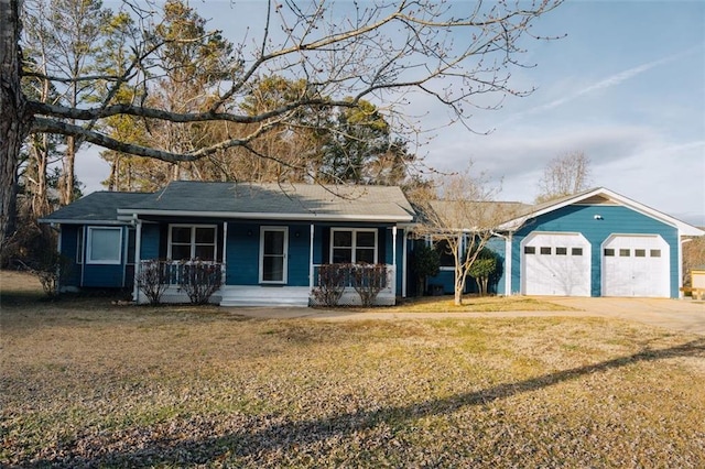 ranch-style house with a garage, covered porch, and a front yard