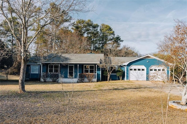 ranch-style home with a garage, covered porch, and a front lawn