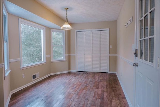 interior space featuring wood-type flooring and a closet