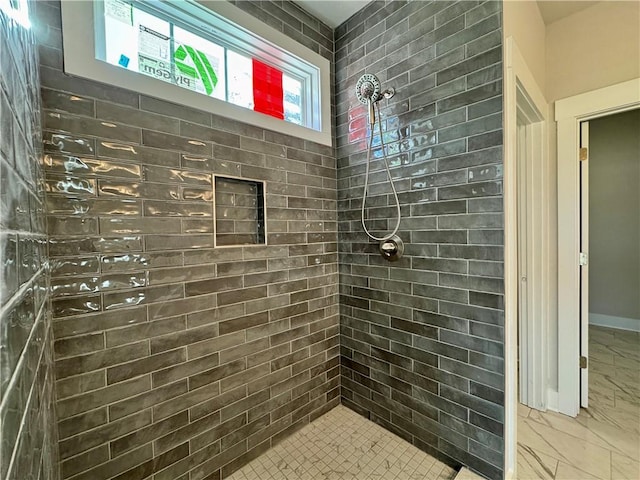 bathroom featuring a tile shower