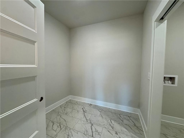 laundry area with marble finish floor, baseboards, laundry area, and washer hookup