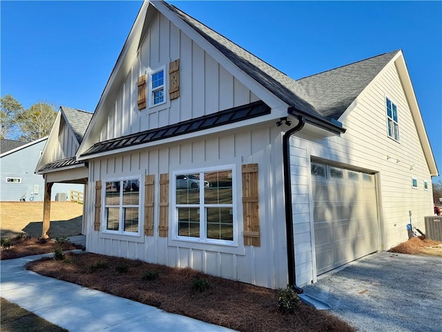 view of property exterior featuring a standing seam roof, metal roof, a shingled roof, and board and batten siding