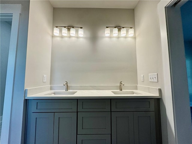 full bathroom featuring a sink and double vanity