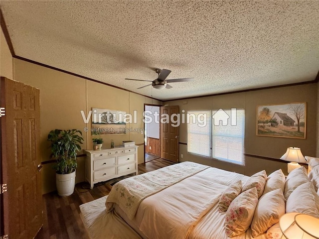 bedroom featuring ceiling fan, dark hardwood / wood-style flooring, crown molding, and a textured ceiling