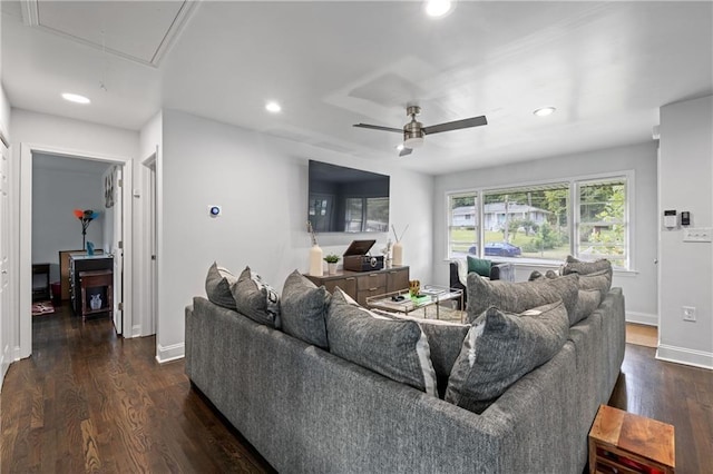 living room featuring ceiling fan and dark hardwood / wood-style flooring