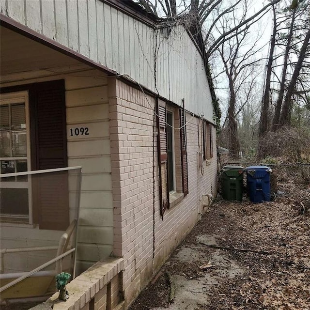 view of property exterior featuring brick siding