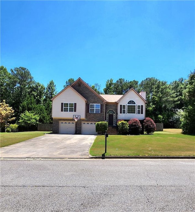 view of front of house featuring a garage and a front yard