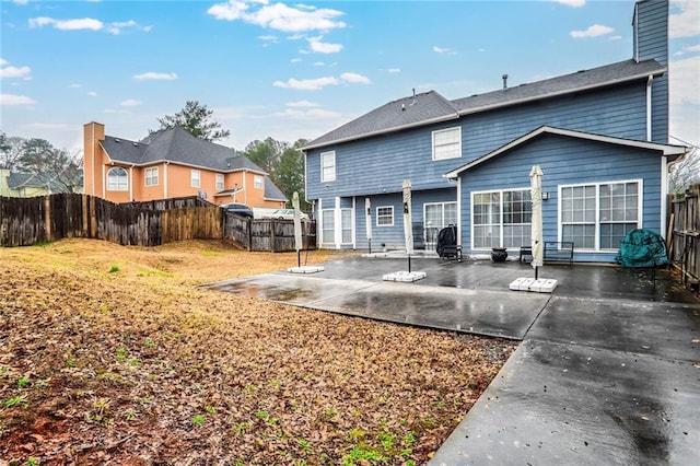 rear view of house with a patio area