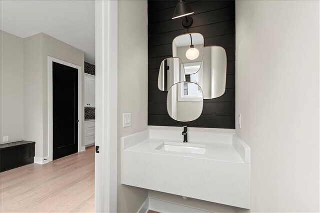 bathroom with vanity and wood-type flooring