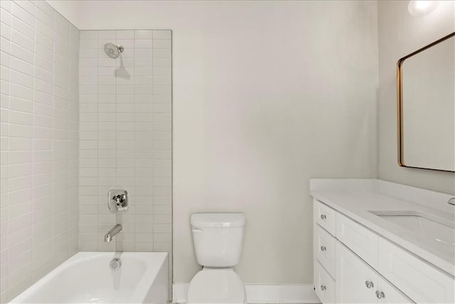 full bathroom featuring vanity, toilet, and tiled shower / bath