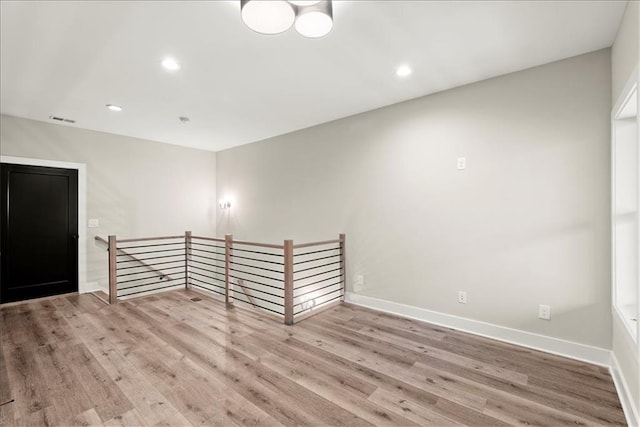 empty room with light hardwood / wood-style floors