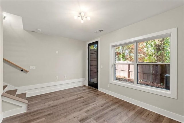 spare room featuring hardwood / wood-style floors