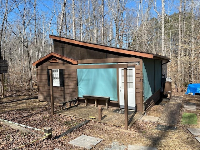 view of property exterior featuring an outbuilding