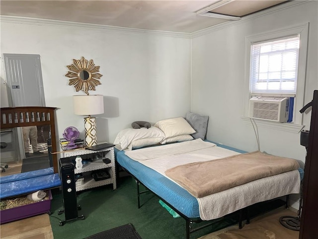 carpeted bedroom featuring cooling unit and crown molding