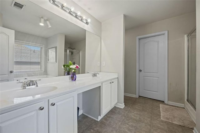 83 Leyland Xing, Dallas, GA 30132 - full bath with a stall shower, double vanity, baseboards, and tile patterned floors