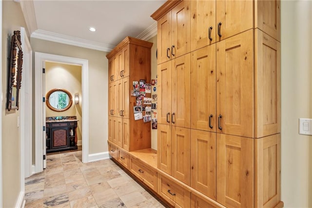 mudroom featuring recessed lighting, baseboards, and crown molding