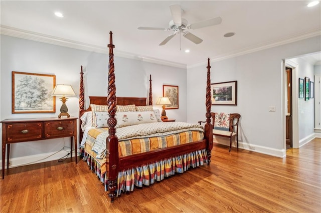 bedroom featuring recessed lighting, wood finished floors, baseboards, and ornamental molding