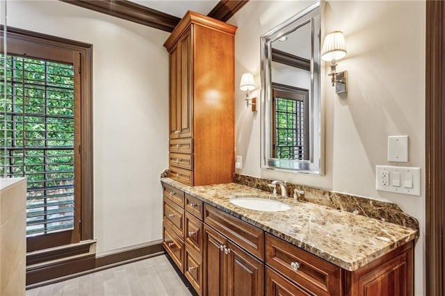 bathroom with vanity and crown molding