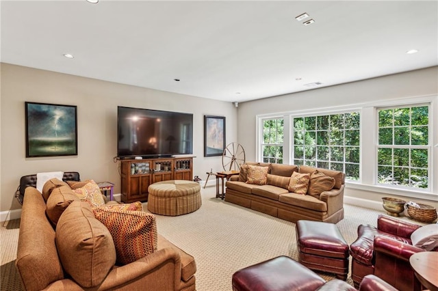 living area featuring recessed lighting, baseboards, and carpet floors