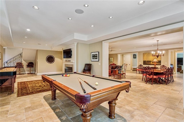 game room with a notable chandelier, billiards, recessed lighting, a fireplace, and baseboards