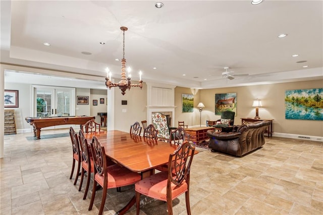 dining room featuring recessed lighting, baseboards, a raised ceiling, and ceiling fan