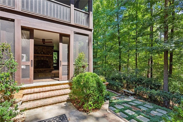 property entrance featuring exterior fireplace