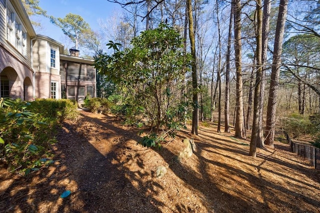 view of yard featuring a sunroom