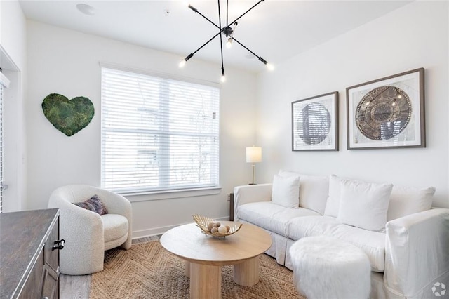 living room with a notable chandelier