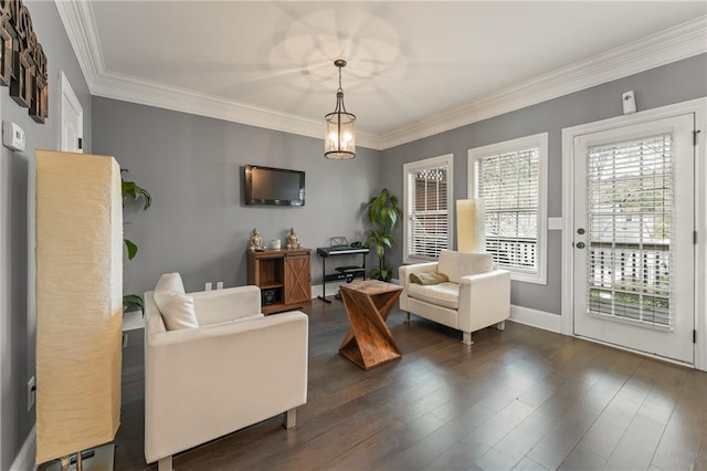 living room featuring dark hardwood / wood-style flooring and ornamental molding