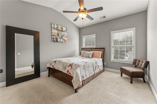 carpeted bedroom with vaulted ceiling and ceiling fan