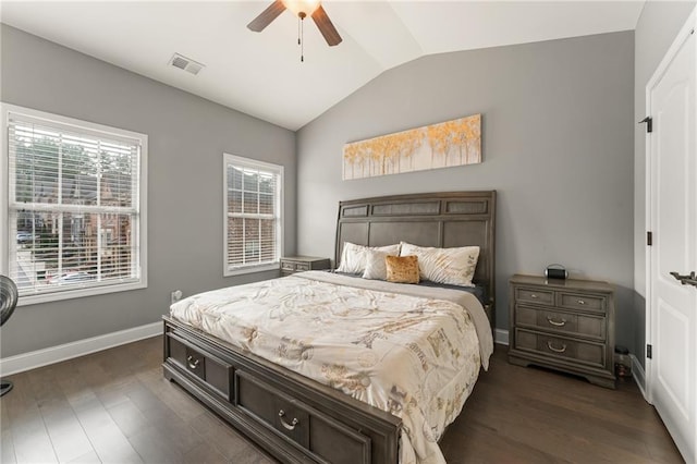 bedroom with ceiling fan, lofted ceiling, and dark hardwood / wood-style flooring