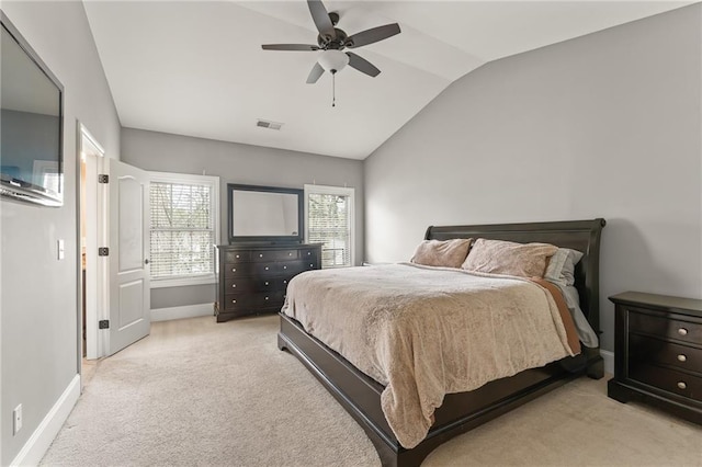 carpeted bedroom featuring lofted ceiling and ceiling fan