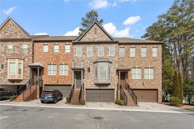 townhome / multi-family property featuring a garage