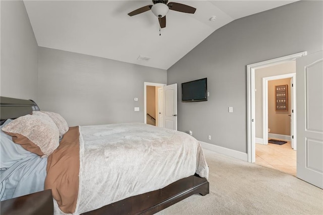 carpeted bedroom featuring vaulted ceiling and ceiling fan