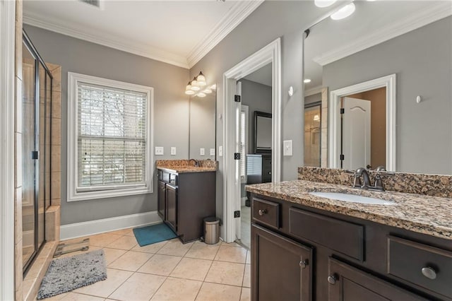 bathroom with ornamental molding, a shower with shower door, tile patterned flooring, and vanity