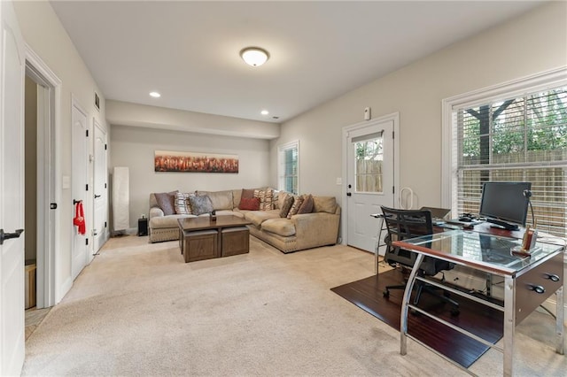 office area featuring light colored carpet