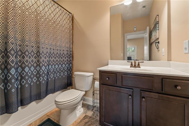 full bathroom with vanity, toilet, and shower / bath combo