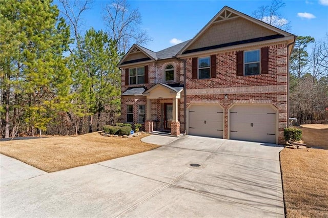 view of front of home featuring a garage and a front lawn