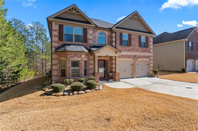 craftsman inspired home with a garage and a front lawn