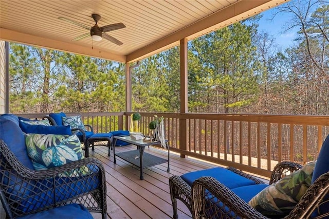 deck featuring an outdoor hangout area and ceiling fan