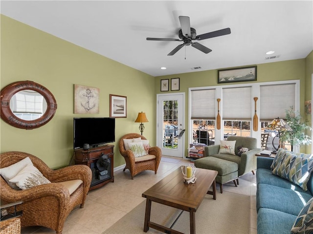 living area with tile patterned flooring, visible vents, a ceiling fan, and recessed lighting