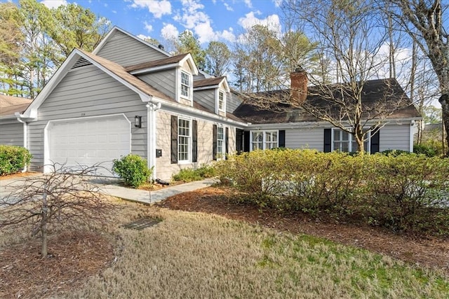 cape cod house featuring a garage