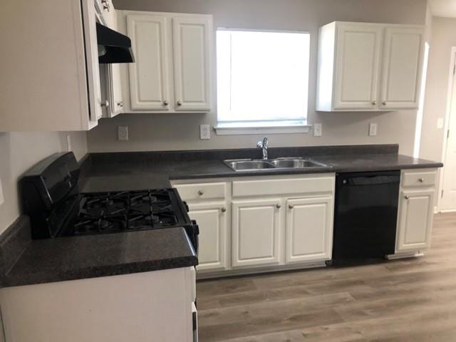 kitchen with sink, white cabinetry, black dishwasher, gas stove, and light wood-type flooring