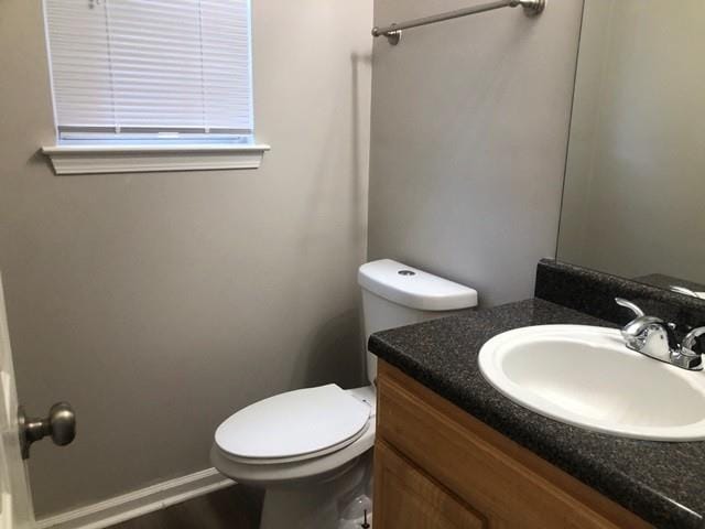 bathroom featuring vanity and toilet