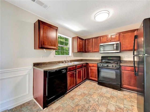 kitchen with sink and black appliances