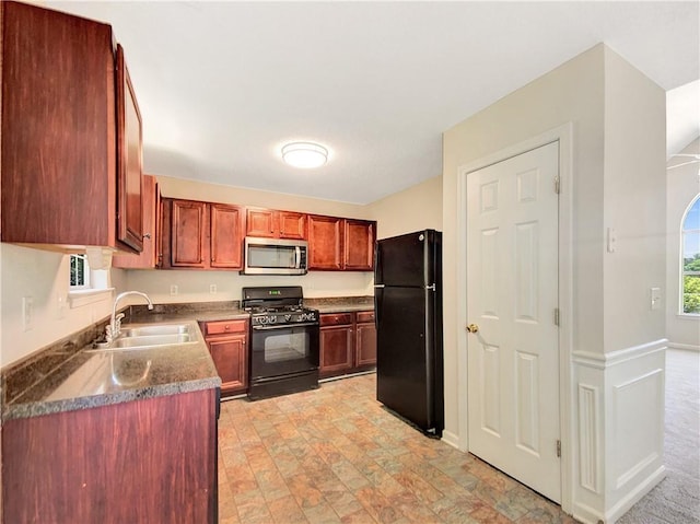 kitchen with sink and black appliances